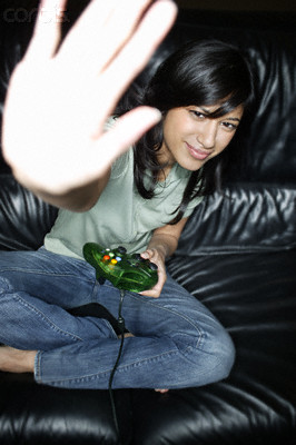 Woman Playing Video Games --- Image by ï¿½ Roy McMahon/Corbis
